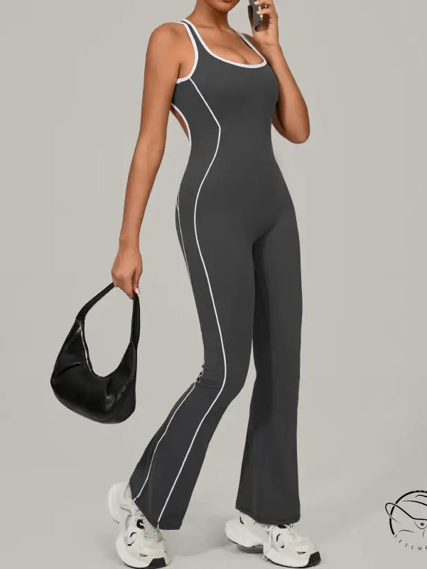 Charcoal gray Beauty Back Yoga Jumpsuit with white piping and red accents in langry fashion