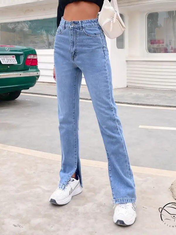 Light wash high-waisted straight-leg denim pants with ankle slit