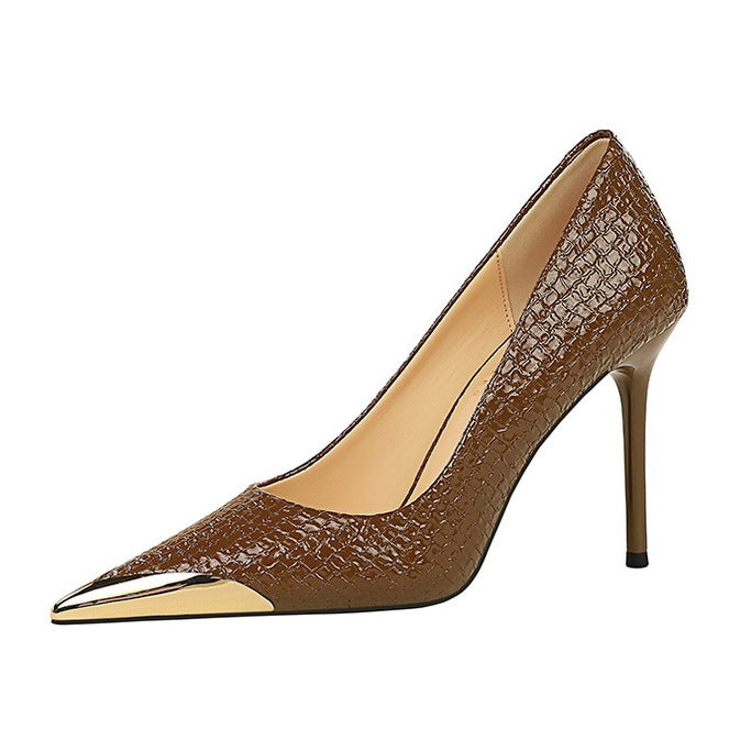 Brown textured stiletto heel with gold toe cap, perfect for stylish fashion ensemble