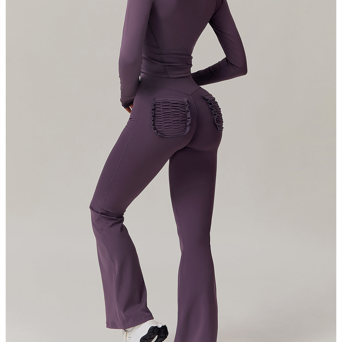 Purple athletic set with ruched detailing ideal for casual fashion and ملابس enthusiasts