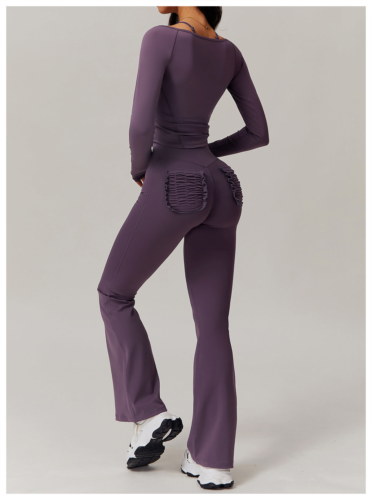 Purple athletic set with ruched detailing ideal for casual fashion and ملابس enthusiasts