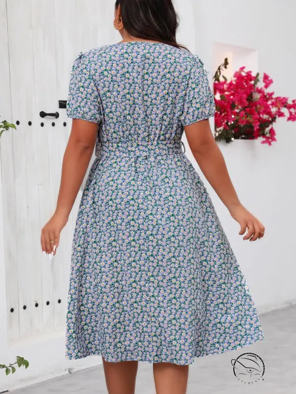 Green floral summer dress with short sleeves and tie waist