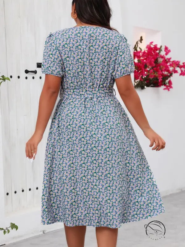Green floral summer dress with short sleeves and tie waist