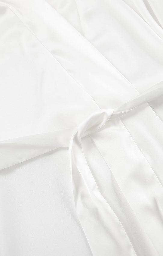 White pleated langry satin dress with elastic waist and scalloped hem