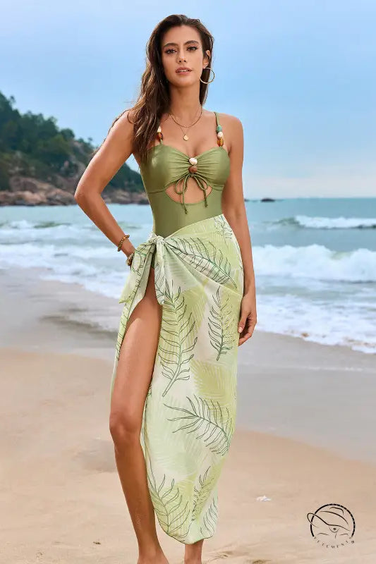 Olive green one piece swimsuit with tropical leaf print and front tie