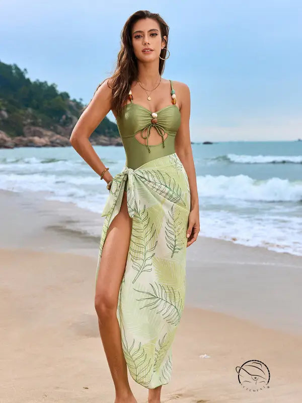 Olive green one piece swimsuit with tropical leaf print and front tie