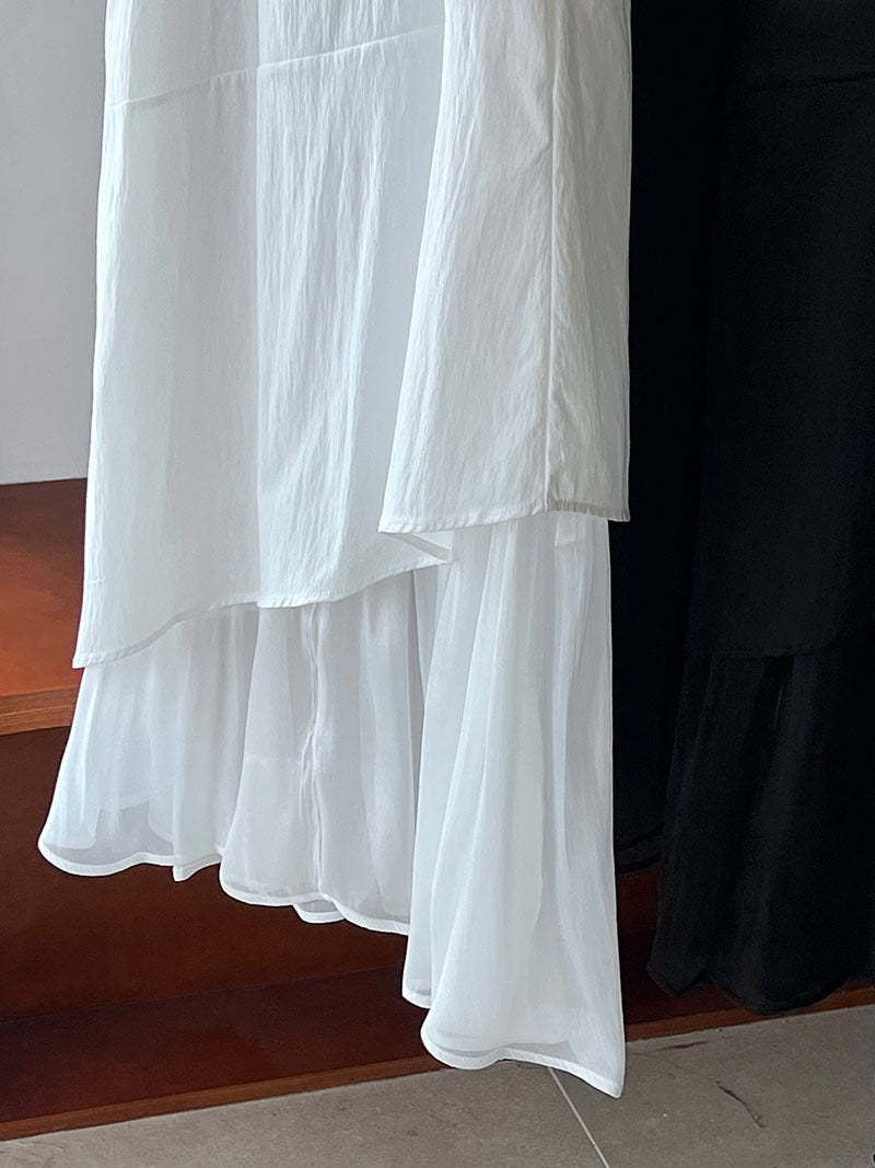 Flowing white layered ruffled fabric of an elegant Korean style dress