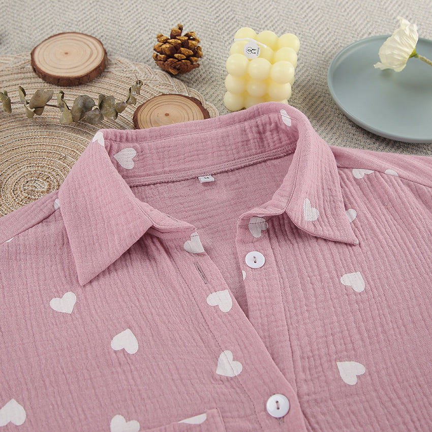 Pink long-sleeved pajamas set with white heart patterns for comfortable fashionable homewear