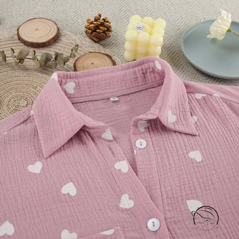 Pink long-sleeved cotton pajamas set with white heart patterns