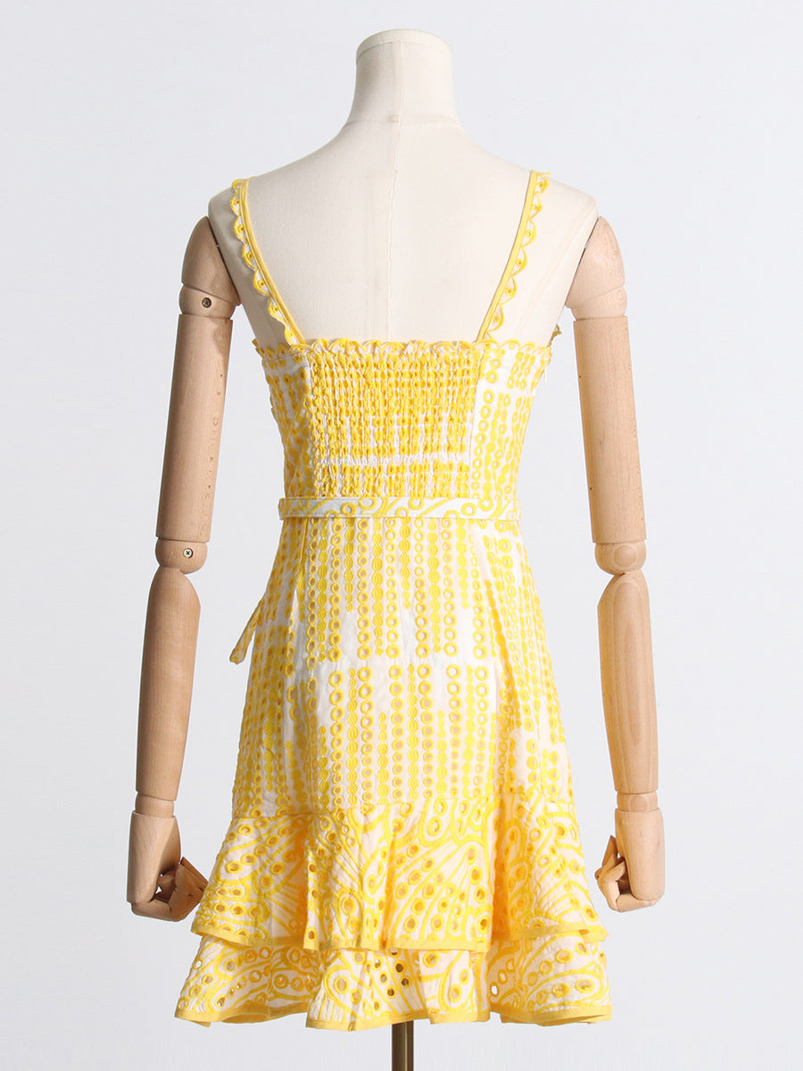 Yellow and white polka dot sundress with ruffled hem, perfect for summer fashion ملابس