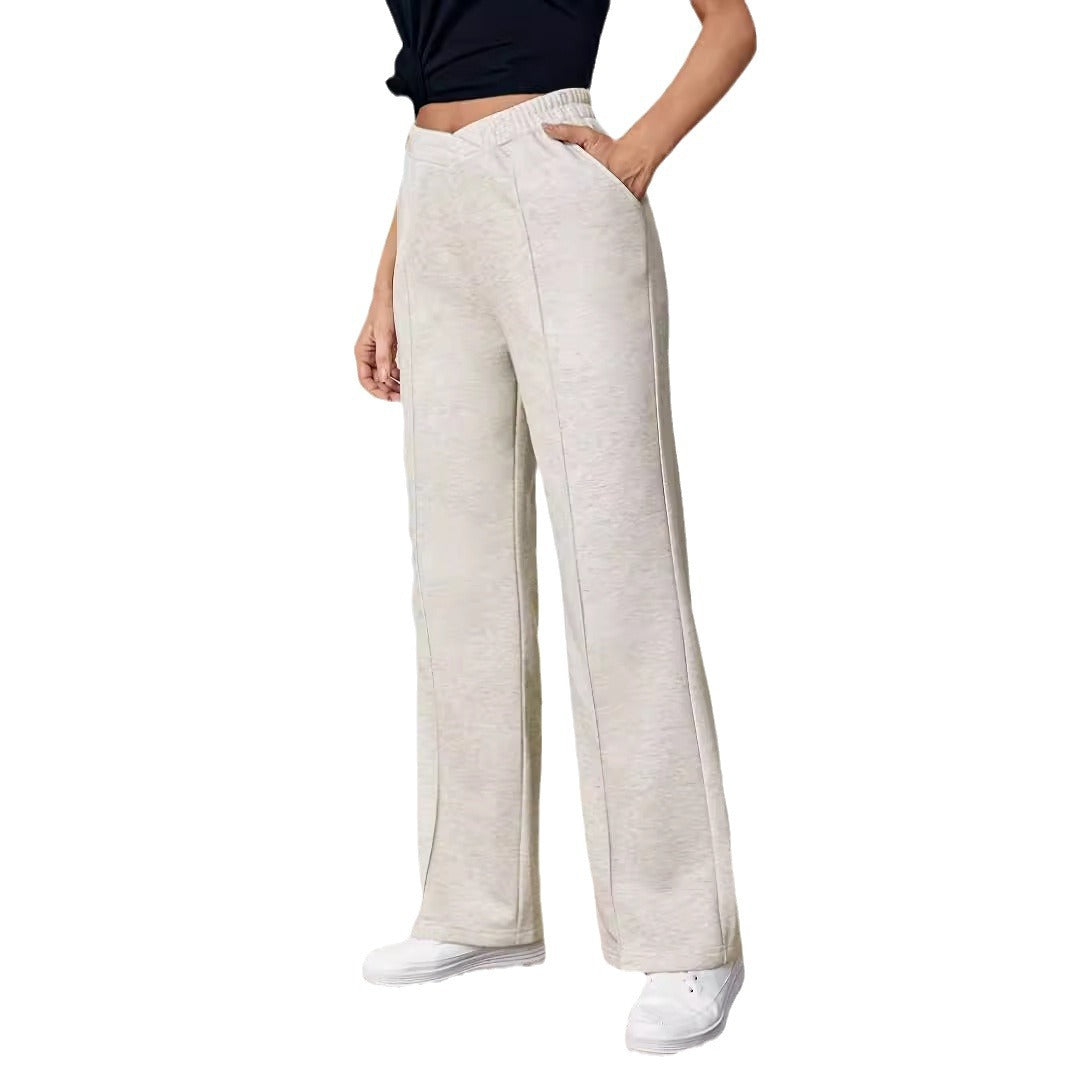 Wide leg cream colored pants with pockets for stylish and comfortable fashion layering