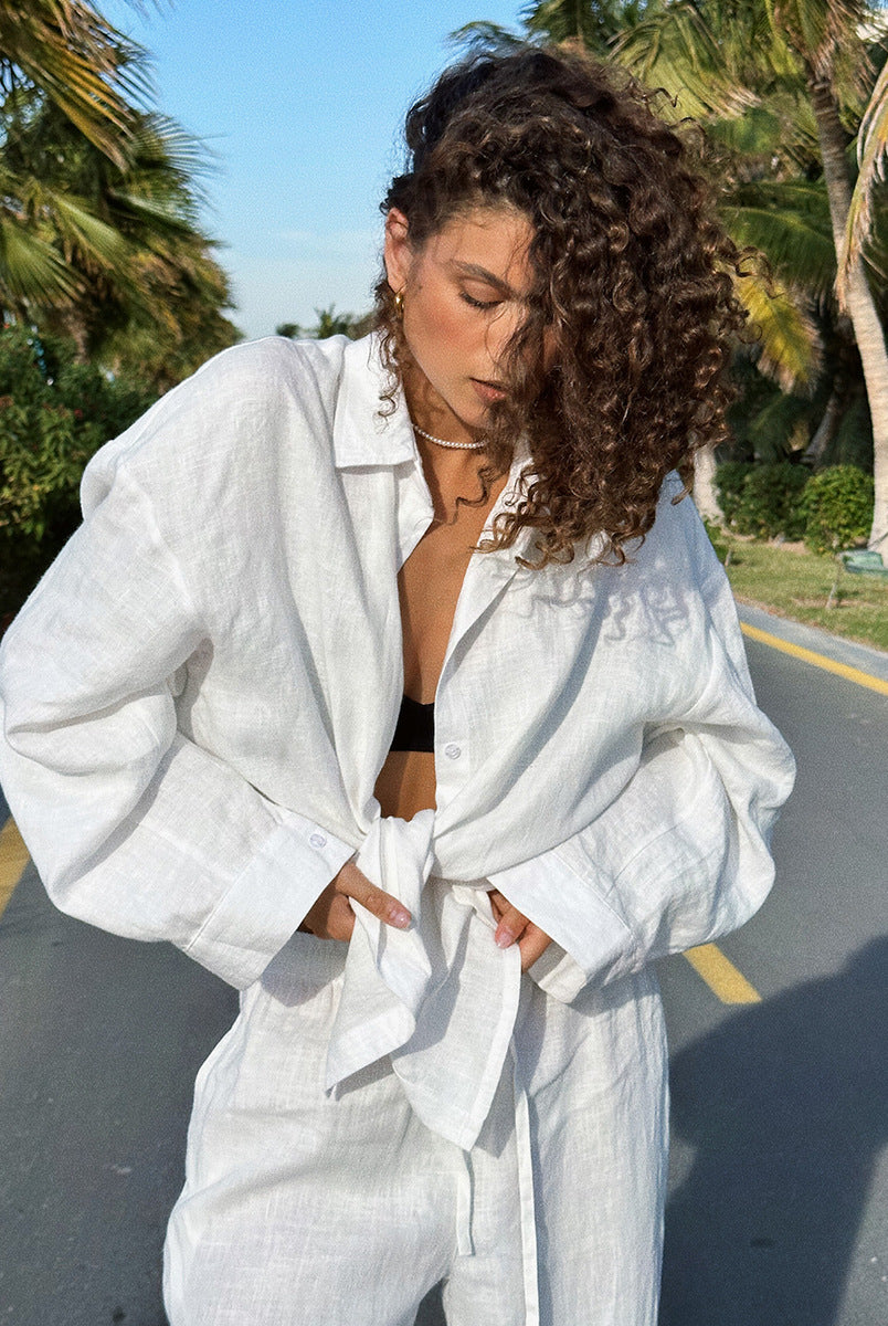 Woman in white linen outfit showcasing langry fashion from Cotton Shirt Trousers Casual Sets