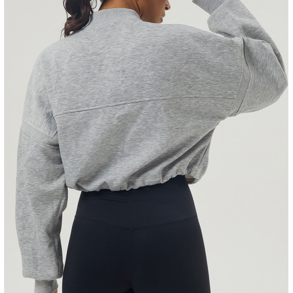 Gray long sleeve cropped sweatshirt with black leggings for autumn winter fashion