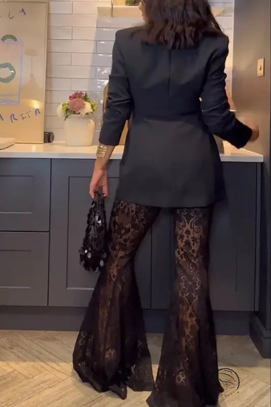 Woman in casual loose lace two piece set with black blazer and pants