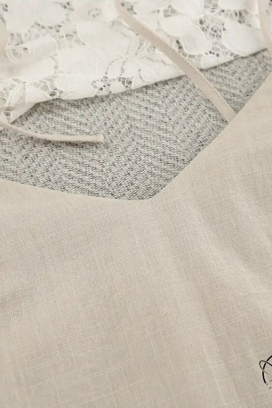 Light-colored backless cotton home wear camisole with thin straps and V-neckline