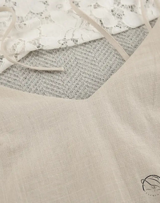 Light-colored backless cotton home wear camisole with thin straps and V-neckline