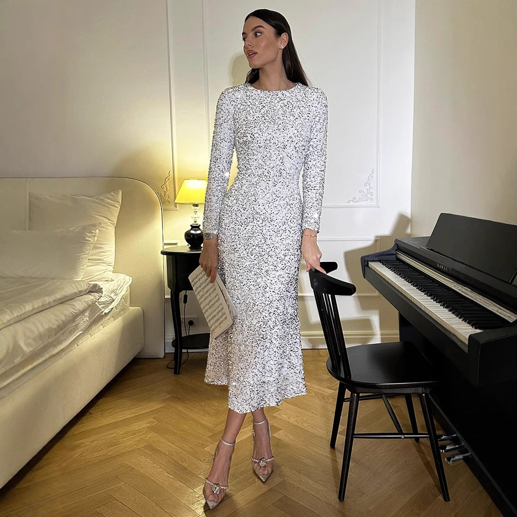 Long-sleeved white sequined midi dress showcasing a slim silhouette for elegant fashion