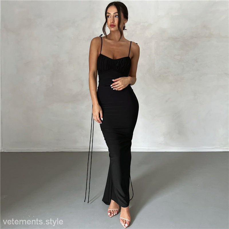 Sleeveless black maxi dress featuring an elegant slim fit sheath design