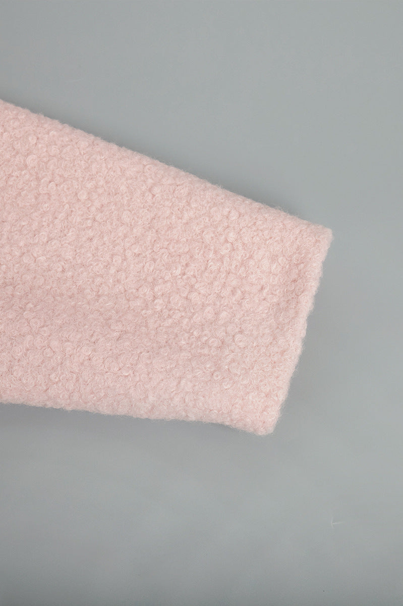 Textured pink fabric detail of Pink Short Furry Coat showcasing a pink short furry material