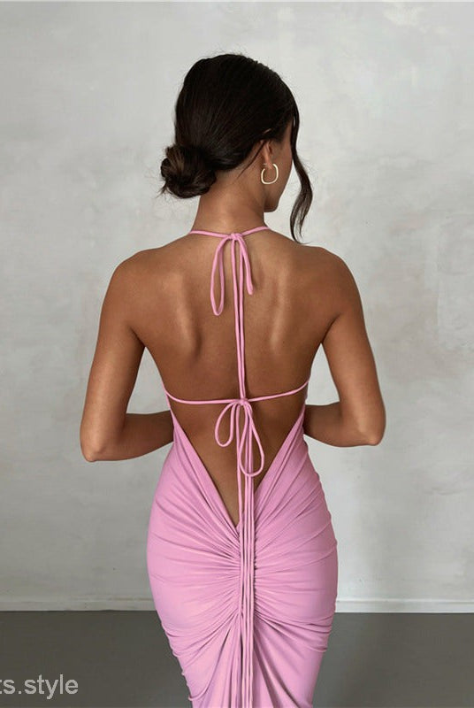 Backless pink halter dress showcasing the elegant slim fit sheath dress design