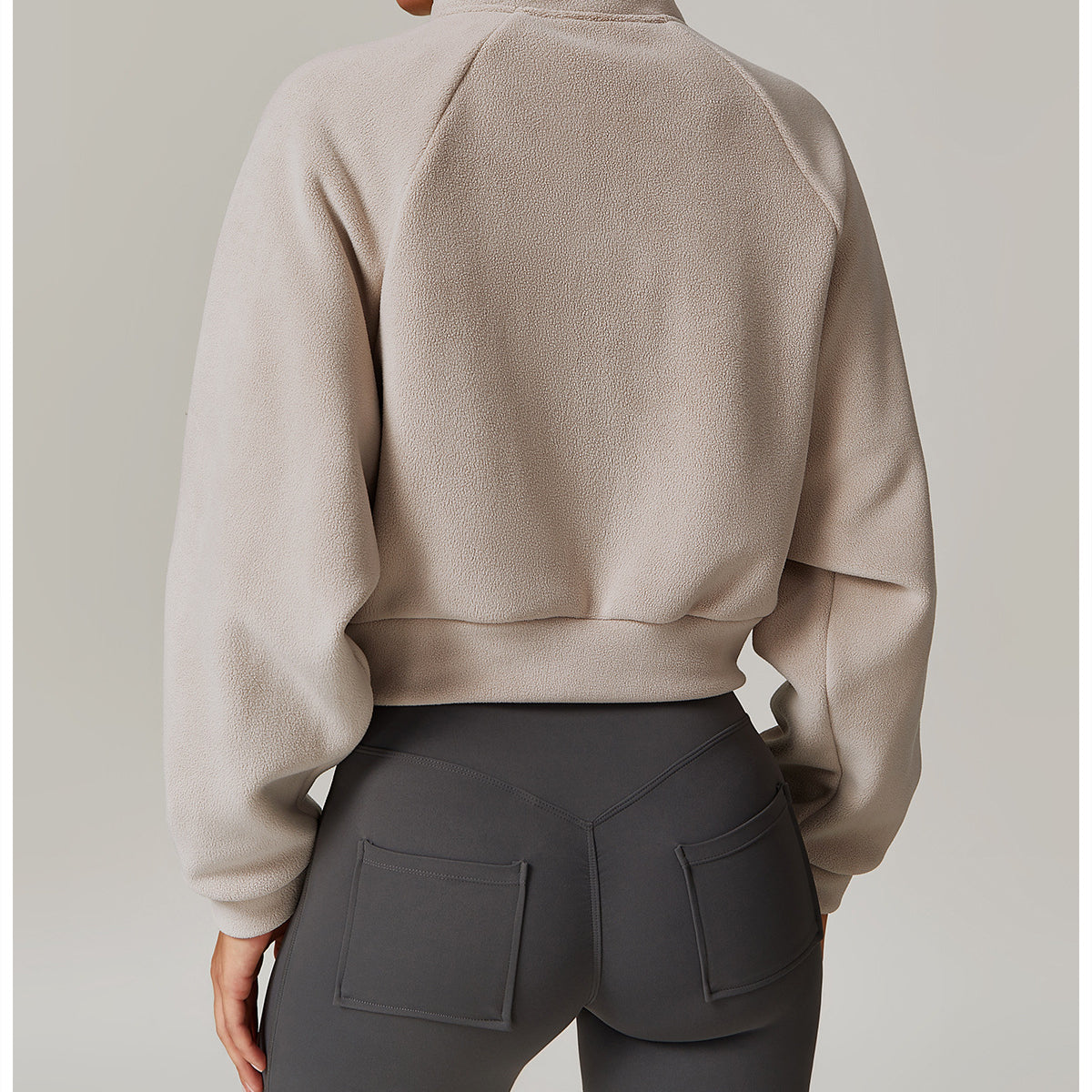 Beige cropped turtleneck sweatshirt with dropped shoulders for langry fashion ملابس