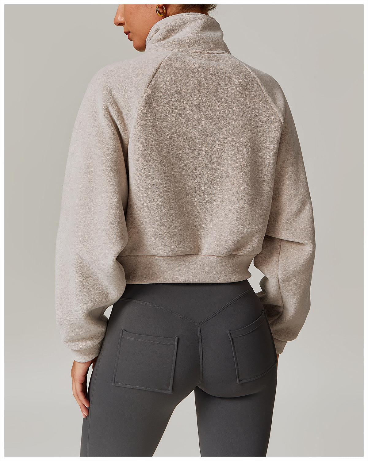 Beige cropped turtleneck sweatshirt with dropped shoulders for langry fashion ملابس