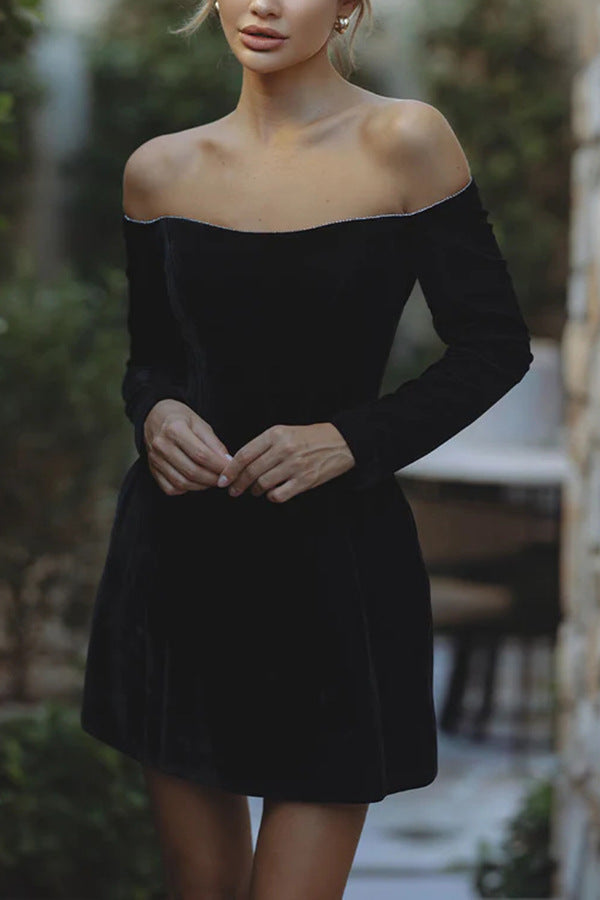 Elegant off-shoulder black mini dress with long sleeves, perfect for stylish fashion lovers