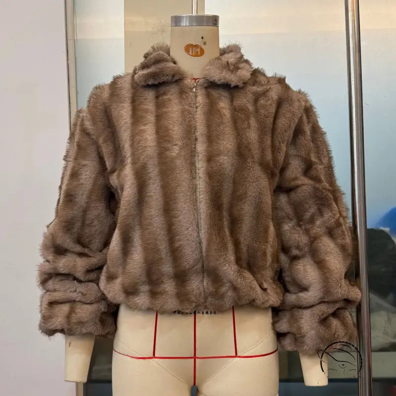 Loose warm faux fur jacket by Langry fashion with hood and zipper
