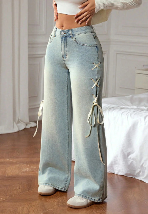 Casual wide leg jeans with light-wash denim and white lace-up detailing
