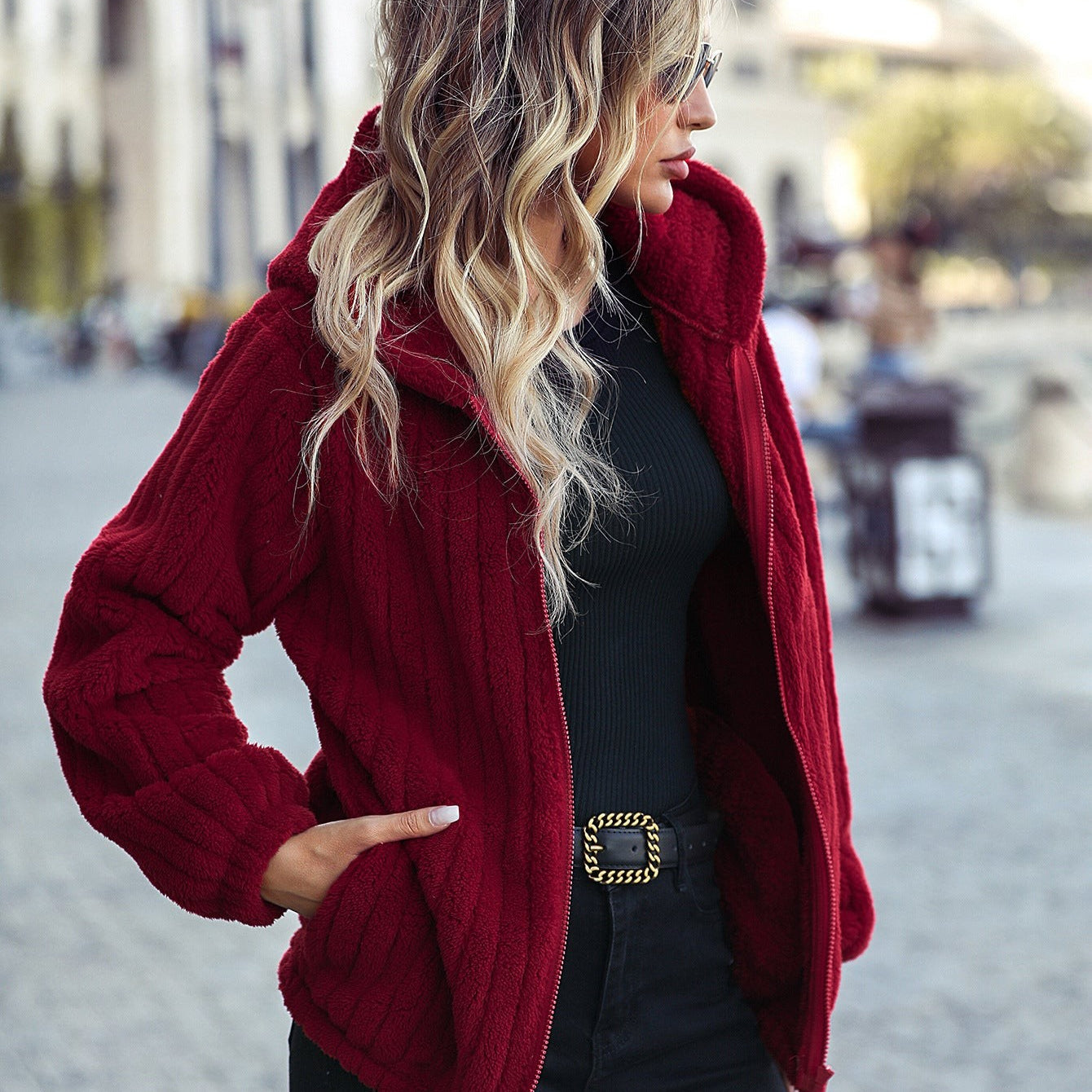 Gorgeous red hooded long sleeve jacket with distressed black jeans for stylish women