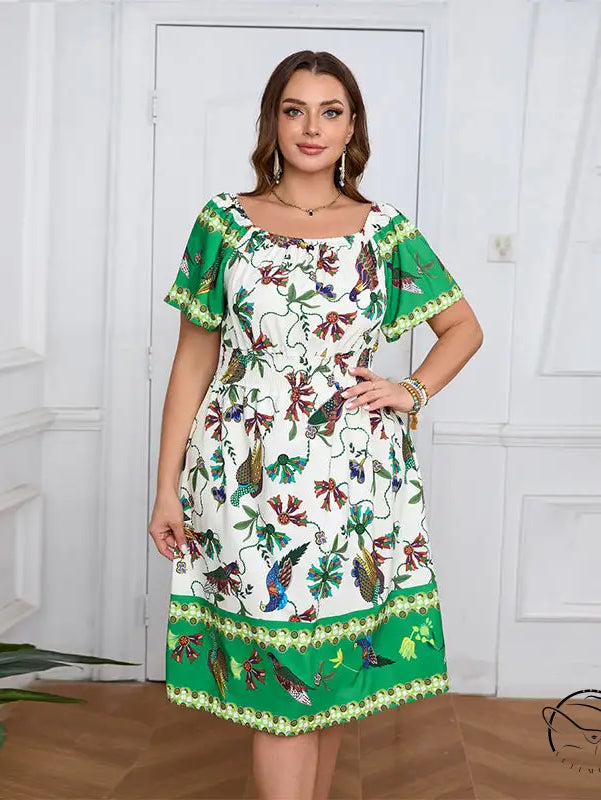 Elegant bohemian dress: white flowy knee-length with green border and floral bird patterns