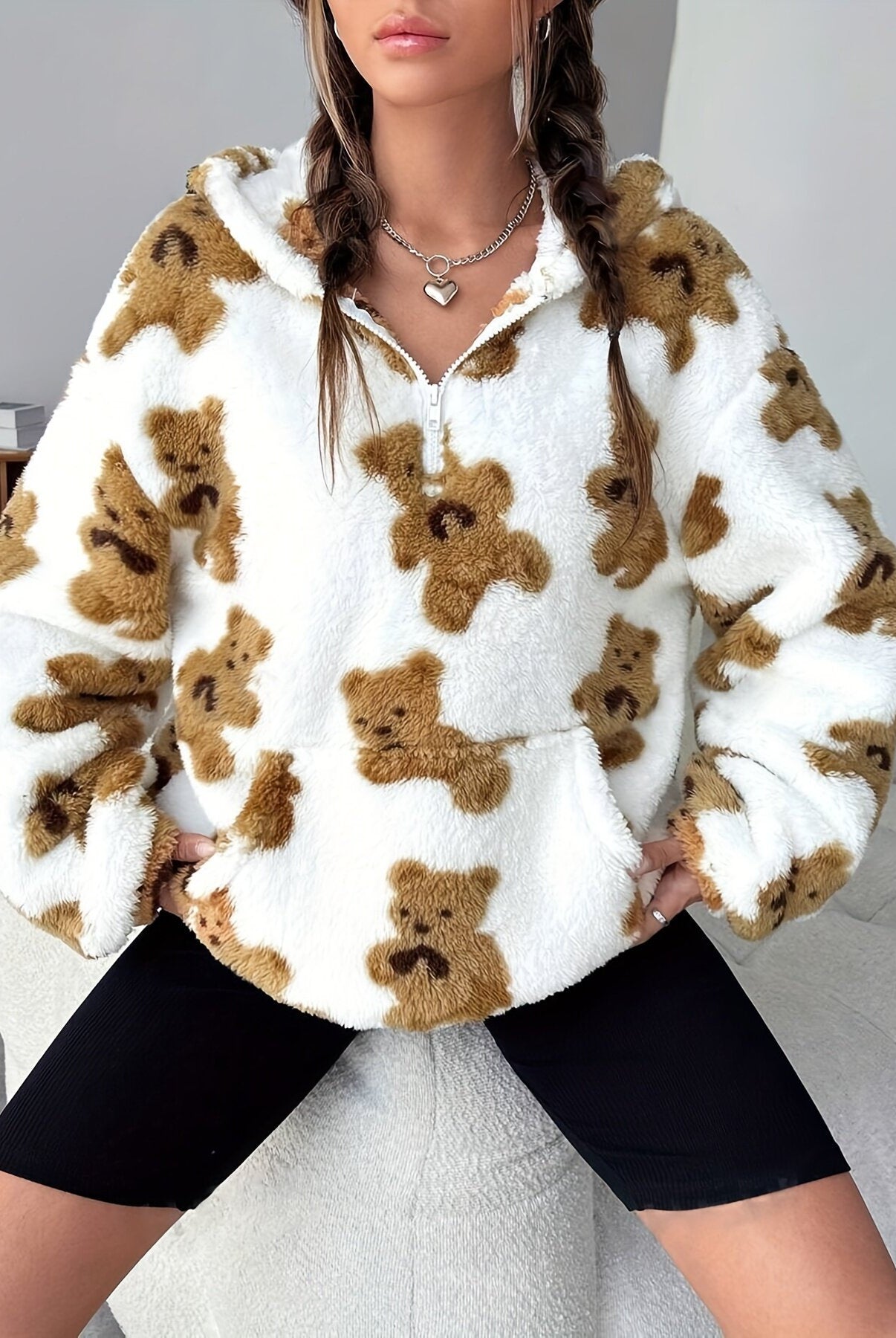 Fluffy white fleece pullover with brown teddy bear print, a stylish langry fashion piece