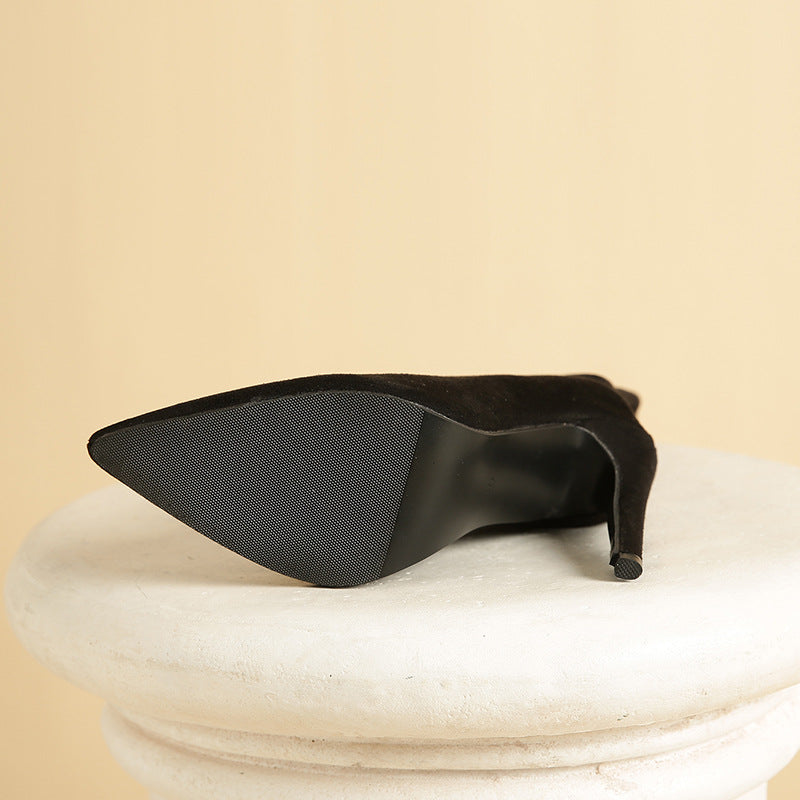 Black suede stiletto bootie showcasing elegant fashion in contemporary ملابس styles