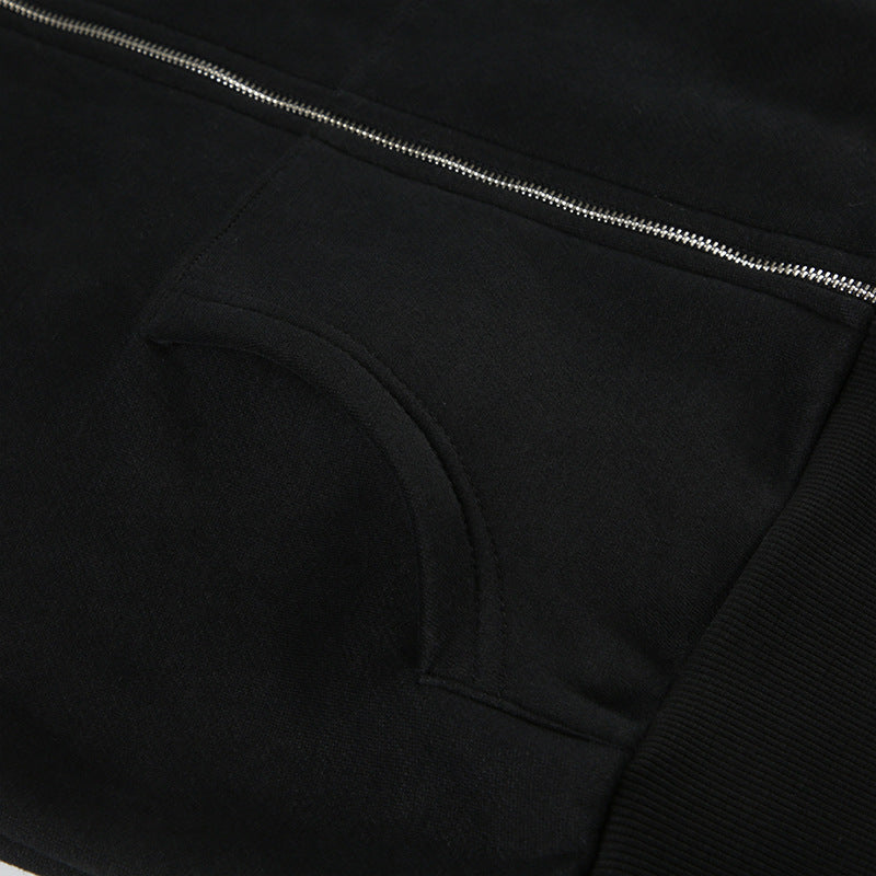 Black hooded sweatshirt with silver zipper and front pouch pocket, perfect for street fashion and ملابس