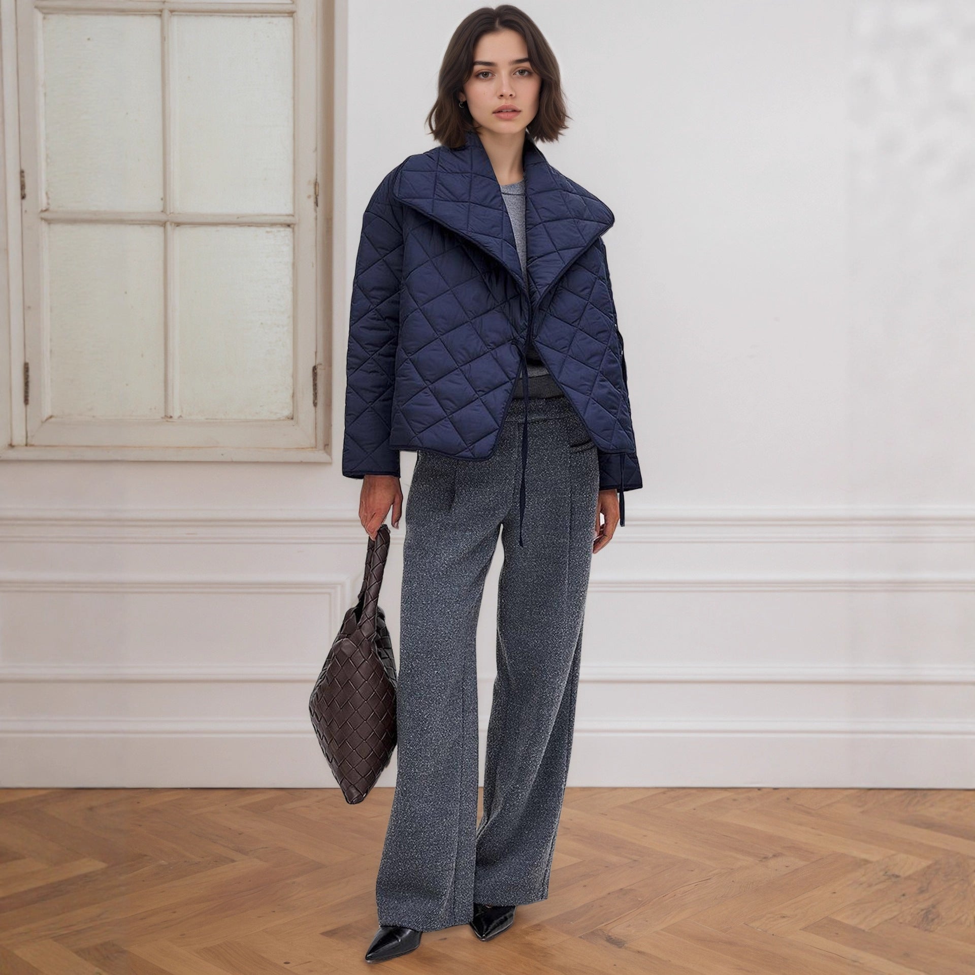 Navy quilted cotton padded coat with high collar and wide-leg jeans