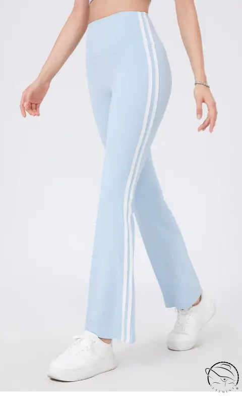 Light blue high waist yoga pants with white stripes and peach hip raise