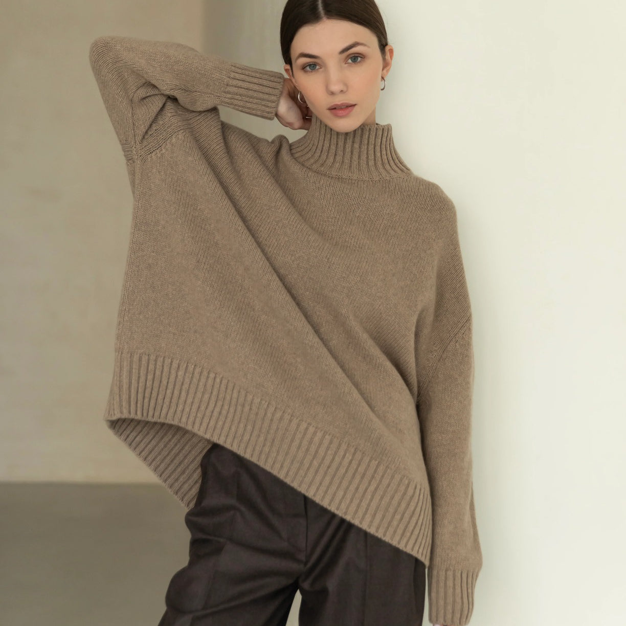 Oversized beige langry fashion turtleneck sweater with asymmetrical hem