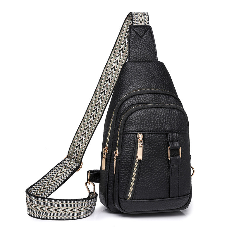 Black faux leather sling bag with patterned strap for trendy fashion and ملابس styles