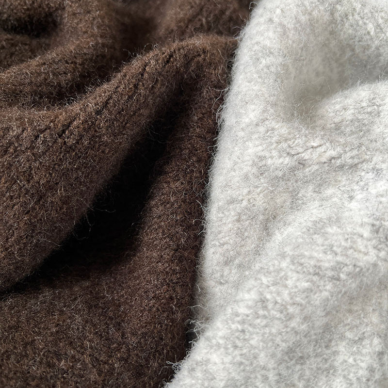 Brown and white fluffy towels, complementing the Loose Casual Cozy Sweater in Langry fashion