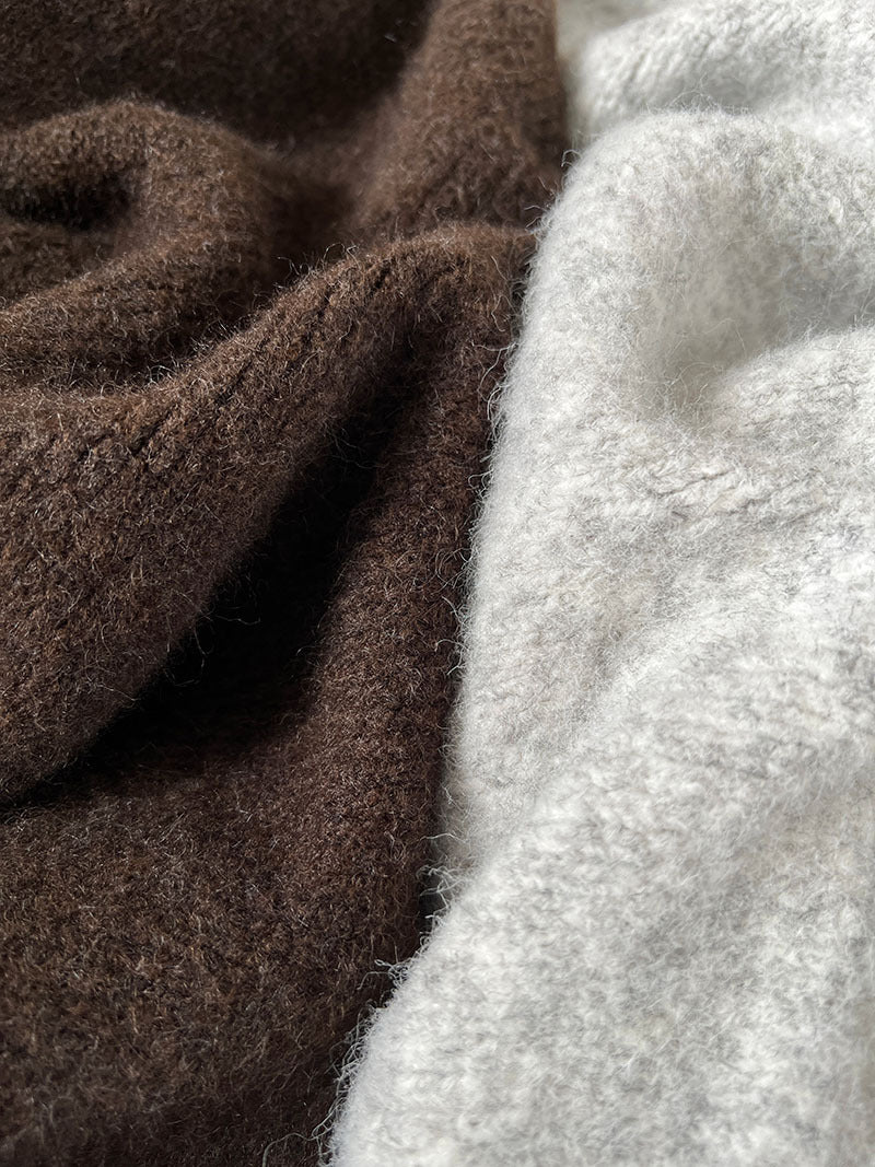 Brown and white fluffy towels, complementing the Loose Casual Cozy Sweater in Langry fashion
