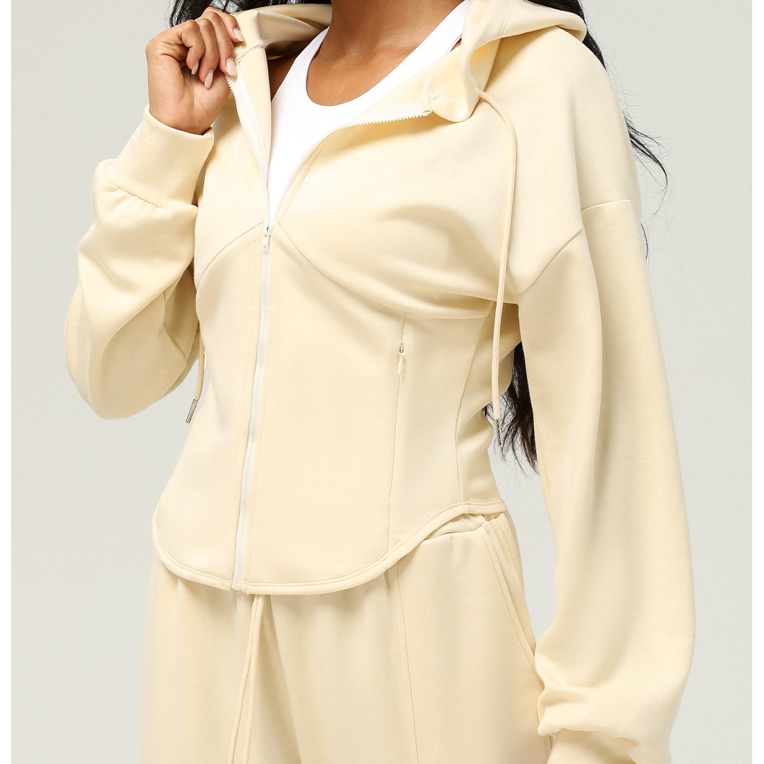 Cream-colored hooded zip-up jacket and pants, perfect for casual fashion by Langry