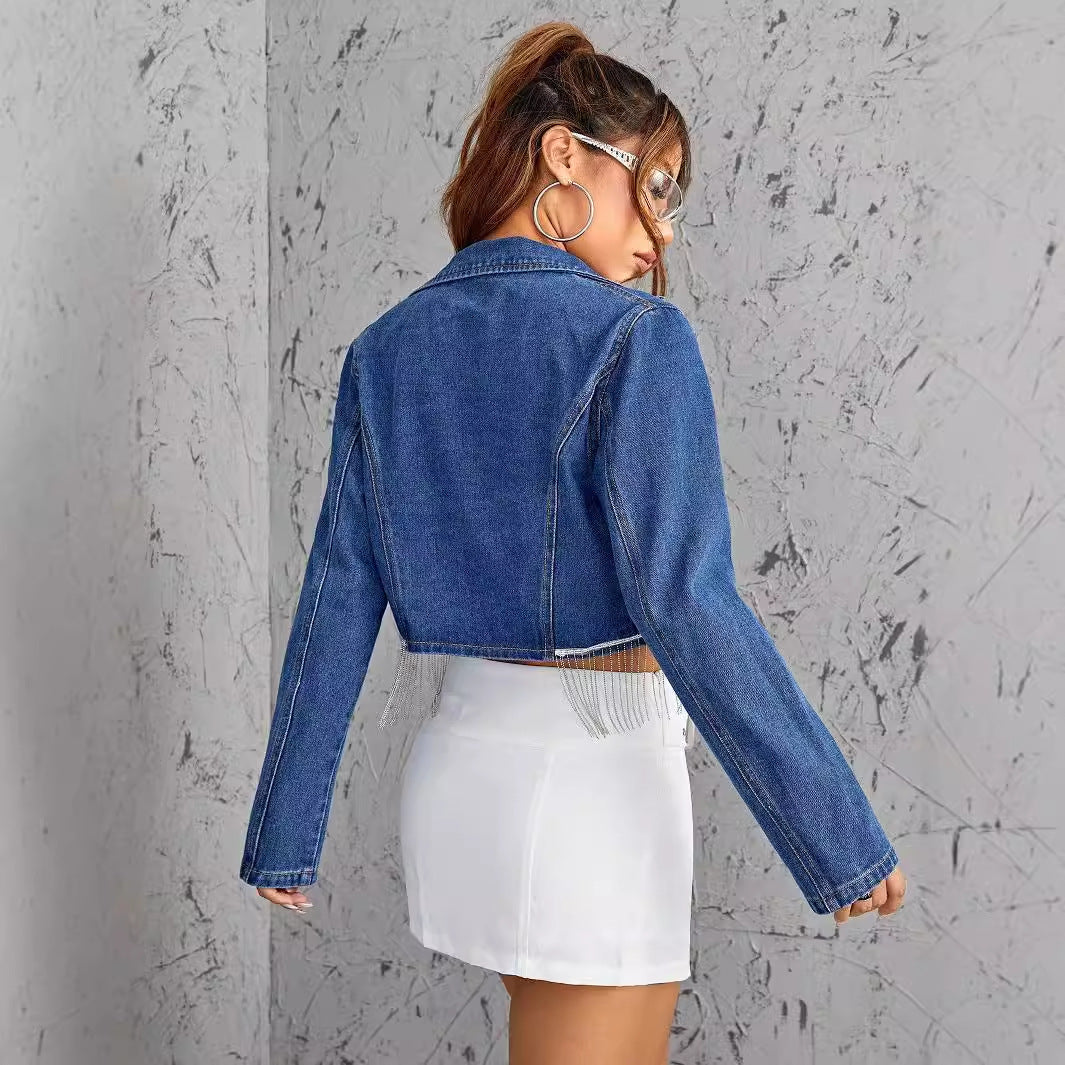 Blue denim cropped jacket with fringe detailing, ideal for slimming short denim looks