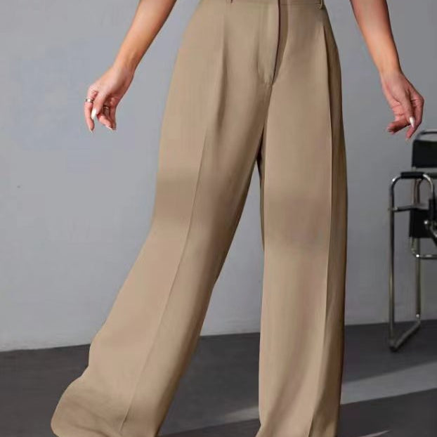 Wide leg khaki trousers styled with white sneakers for a trendy fashion look