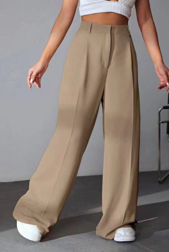 Wide leg khaki trousers styled with white sneakers for a trendy fashion look