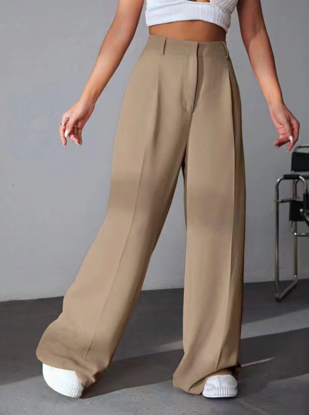 Wide leg khaki trousers styled with white sneakers for a trendy fashion look