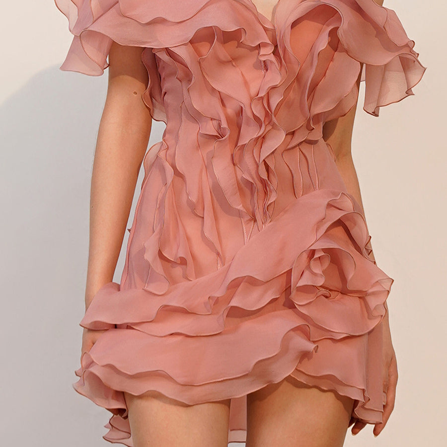 Elegant pink ruffled off-the-shoulder short sleeve dress showcased in fashionable style