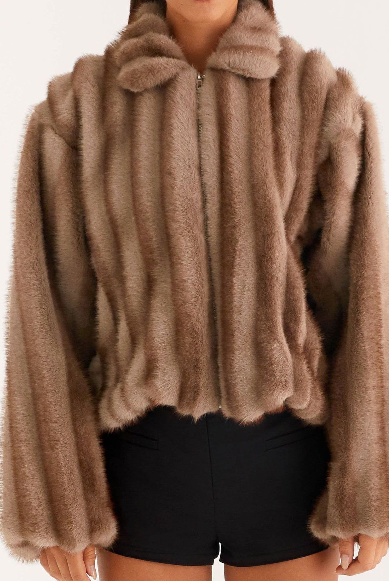 Beige faux fur cropped jacket with high collar and long sleeves