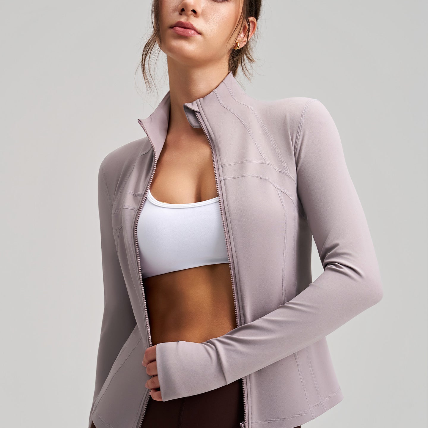 Long sleeve lavender zip-up yoga jacket with drawstring hem and pockets