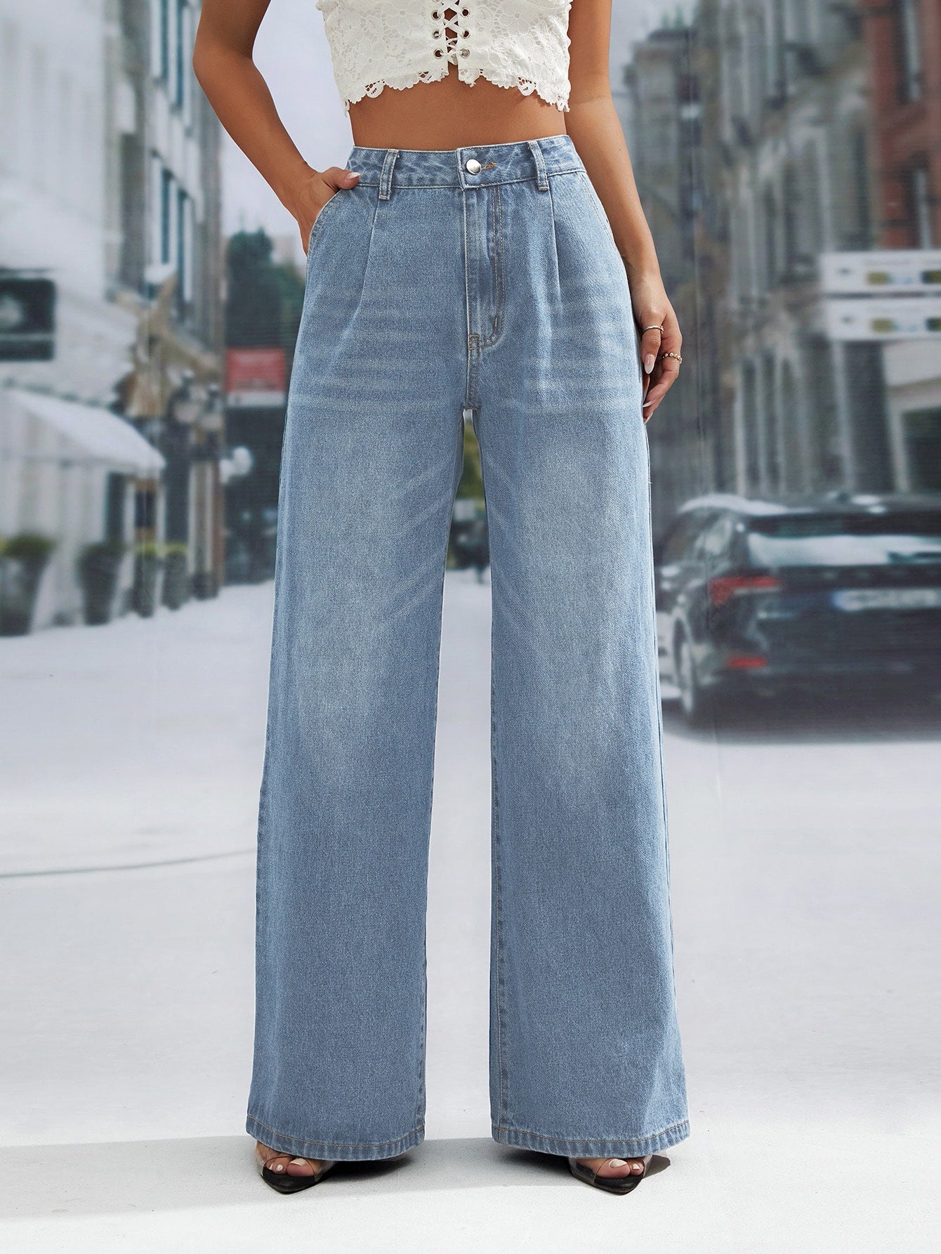 Light wash denim trousers with wide leg and high waist, stylish and flattering fit