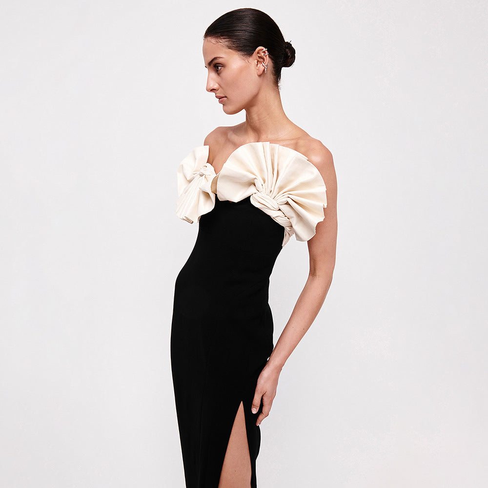 Elegant black evening gown with dramatic white ruffle detail for stylish fashion lovers